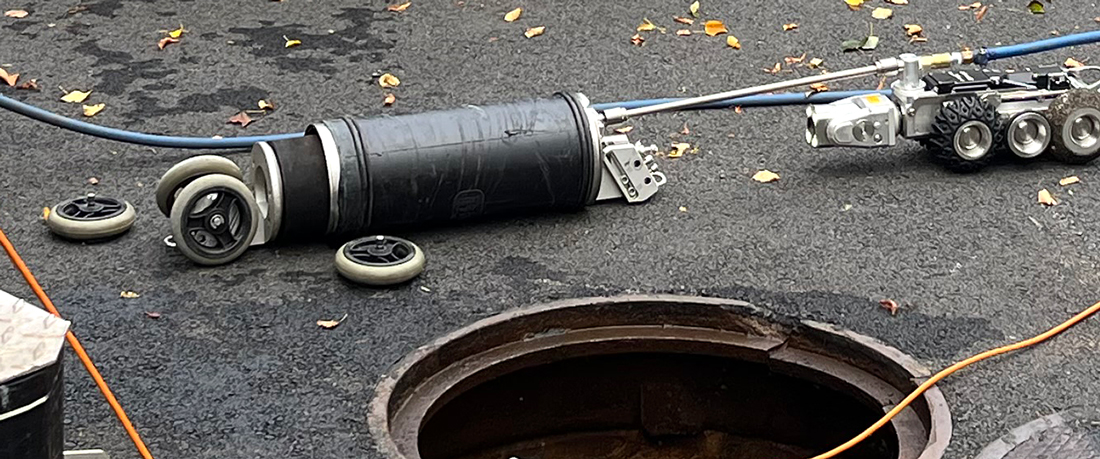 Quick-Lock getting set up near a manhole.